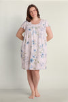 Lavender floral short nightgown with blue flowers, short sleeves, and gathered neckline detail on model.