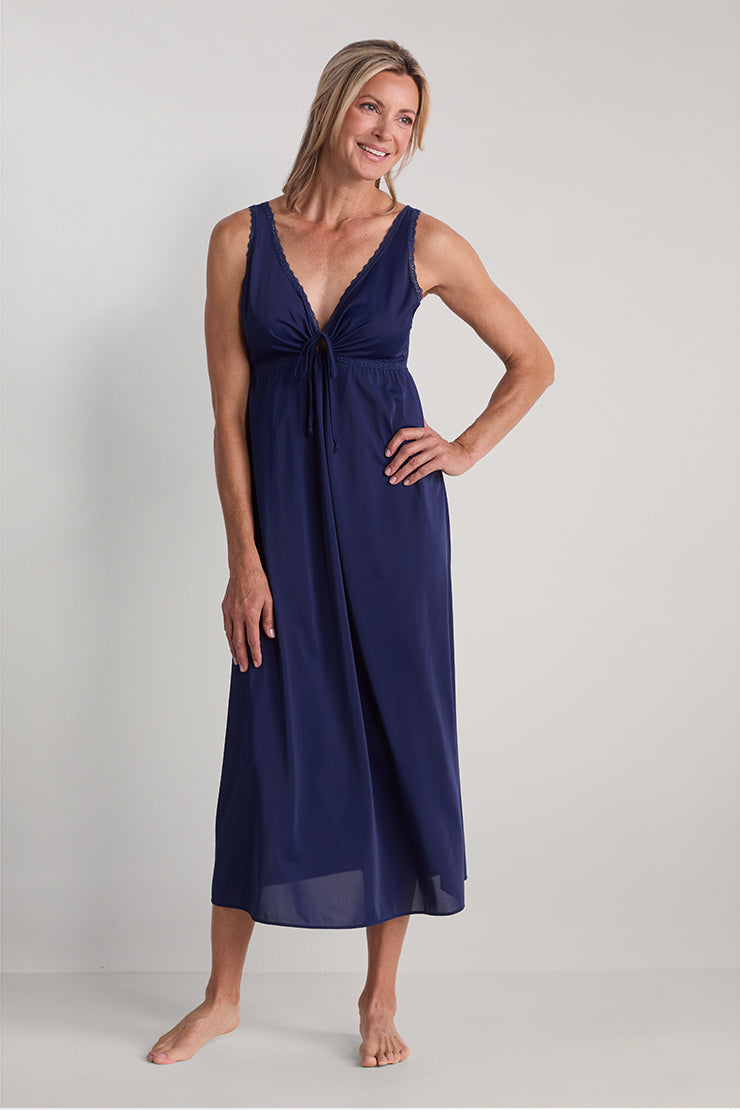 Navy blue sleeveless nightgown with keyhole neckline and tie detail, displayed on model in front view.